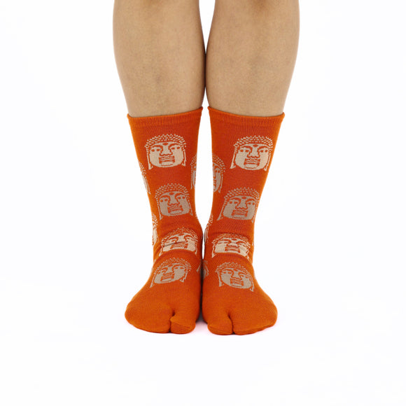 Person wearing long orange Tabi Socks " Nara Daibutsu ", front view