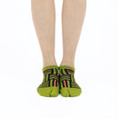 Person wearing short green Tabi Socks " Sankuzushi ", front view