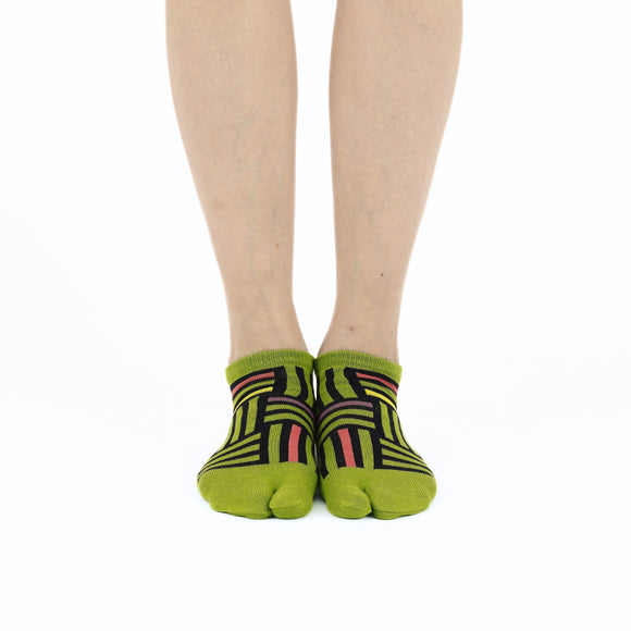 Person wearing short green Tabi Socks " Sankuzushi ", front view