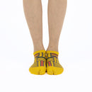 Person wearing short yellow Tabi Socks " Sankuzushi ", front view