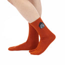Person wearing long orange Tabi Socks " Pixel Daibutsu ", right side view