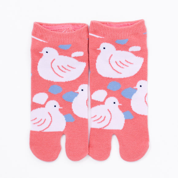 Front view of short orange Tabi Socks " Hato"