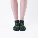 Person wearing short green Tabi Socks " Kamakura Daibutsu ", front view