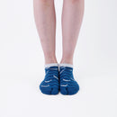 Person wearing short blue Tabi Socks " Shirasu ", front view