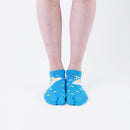 Person wearing short blue Tabi Socks " Surfer ", front view