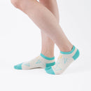 Person wearing short light yellow Tabi Socks " Shika Origami ", right side view