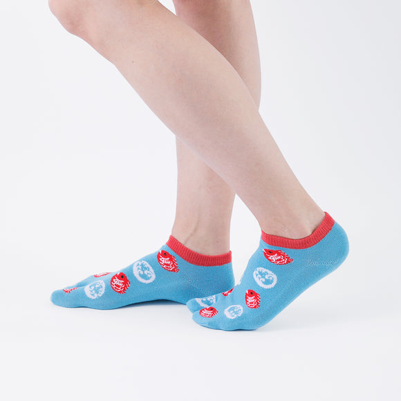 Person wearing short light blue Tabi Socks " Tai ", right side view