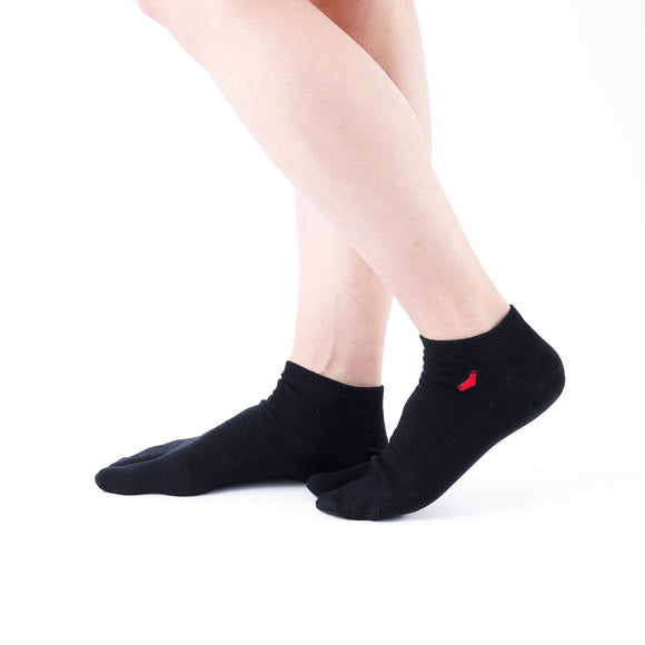Person wearing short black Tabi Socks "TABI-JI", right side view
