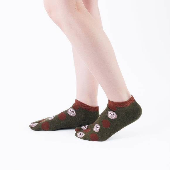 Person wearing short dark green Tabi Socks " Fukuro ", right side view