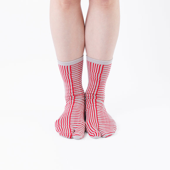 Person wearing long red Tabi Socks " Hyoshigi ", front view