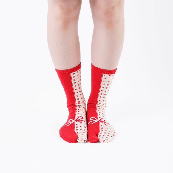 Person wearing long red Tabi Socks " Goen ", front view