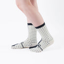 Person wearing long black Tabi Socks " Goen ", right side view