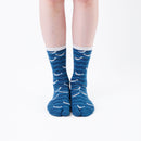 Person wearing long blue Tabi Socks " Shirasu ", front view