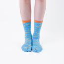 Person wearing long light blue Tabi Socks " Shirasu ", front view