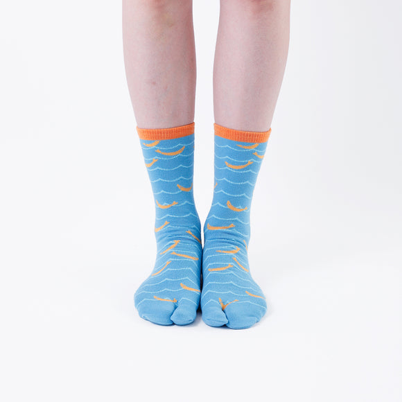 Person wearing long light blue Tabi Socks " Shirasu ", front view