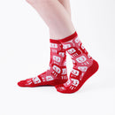 Person wearing long red Tabi Socks " Daruma ", right side view
